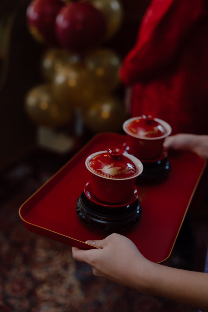 Lucinda and Matthew during their Chinese tea ceremony with close family at Woodbine Mansion in Austin, Texas