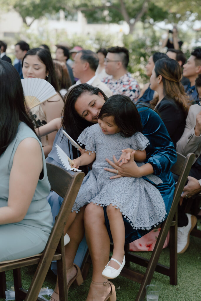 Family and friends watching the ceremony with smiles and tears in Austin Texas