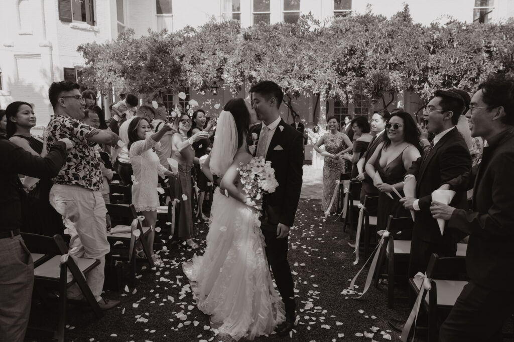 Lucinda and Matthew walking down the aisle as husband and wife at Woodbine Mansion
