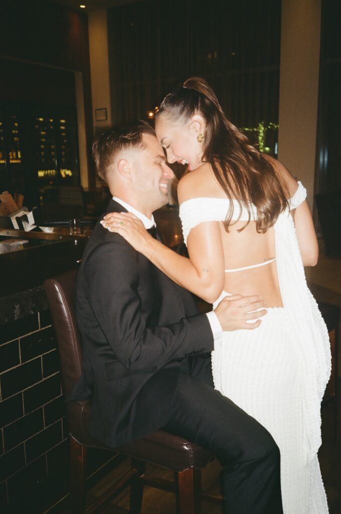 35mm film photo of the couple enjoying a relaxed moment together at the hotel bar during their Austin engagement session