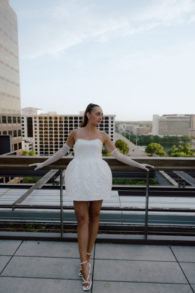 Marley looking over at Jared with a warm smile during their Austin engagement session at sunset