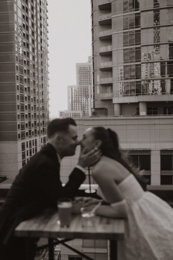 A quiet intimate moment shared between the couple during their rooftop engagement session in Austin