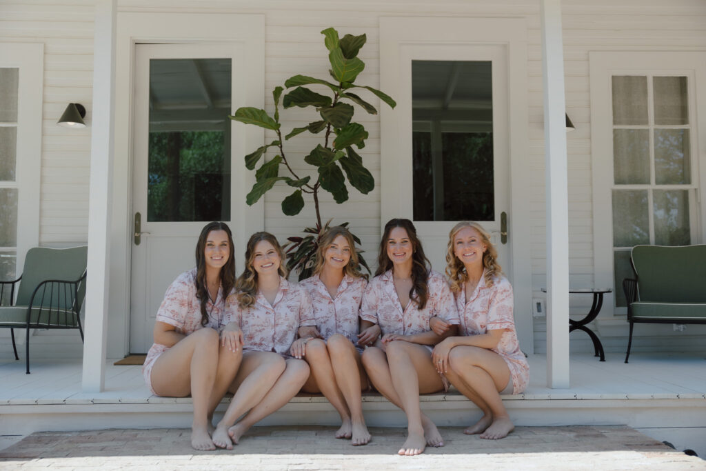 Mallory getting ready in the bridal suite with her bridal party